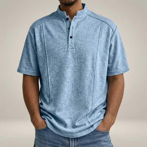 Brian - Playera cómoda de manga corta | Replace only the background of this product photo with a seamless warm greige studio backdrop — a soft neutral tone between light taupe and cream, with a subtle
